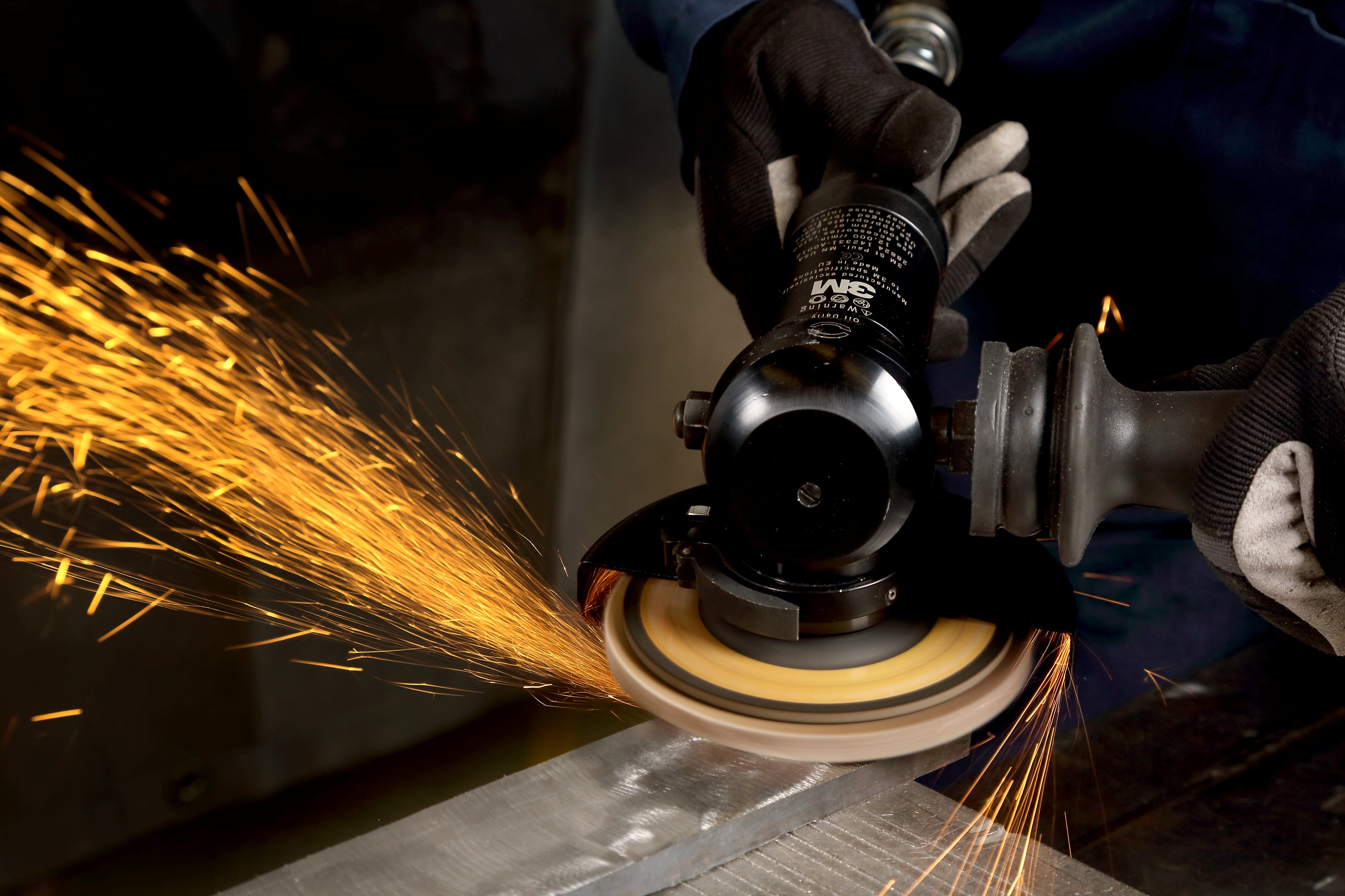 Flap disc on a right angle tool with sparks