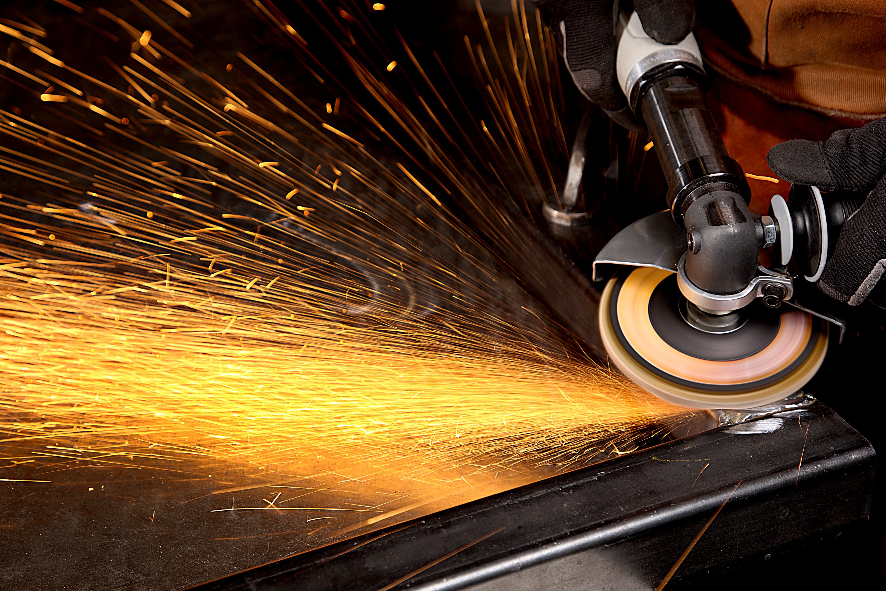 Flap disc on a right angle tool with sparks